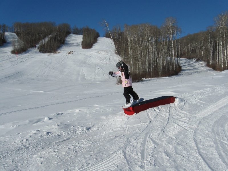A snowboarder making their way down the snowy slopes of Duck Mountain in Kamsack Saskatchewan Canada. The tranquil scenery is a perfect backdrop for an exhilarating ride.