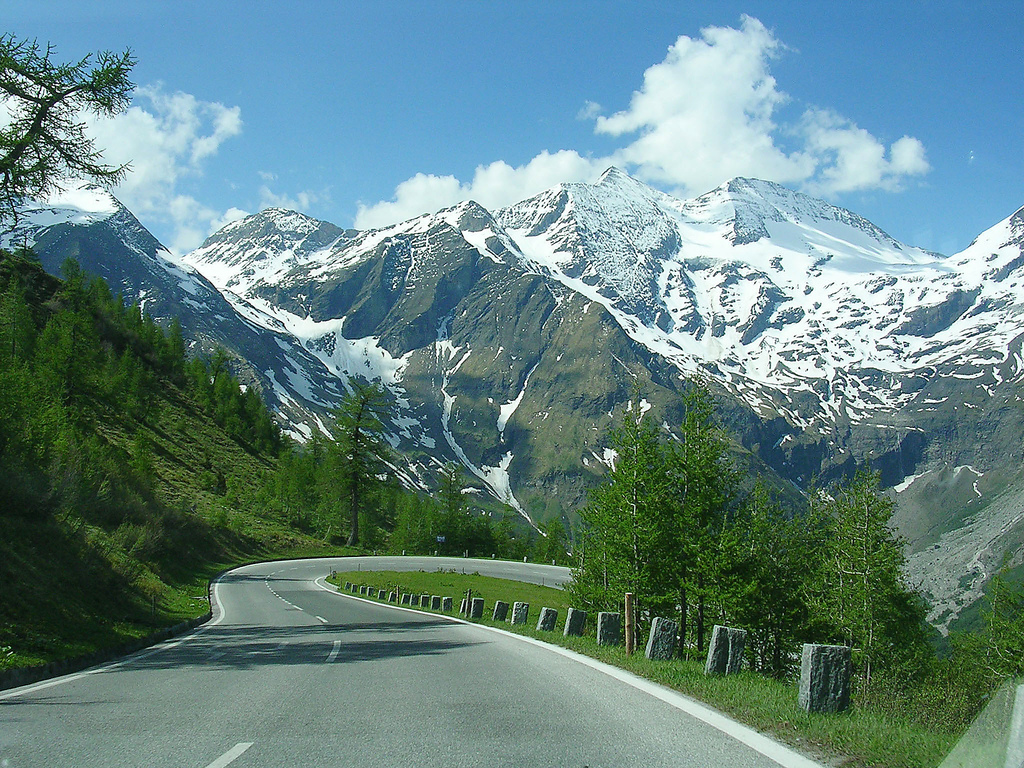 Grossglockner in Austria - a view of a road with mountains in the background.