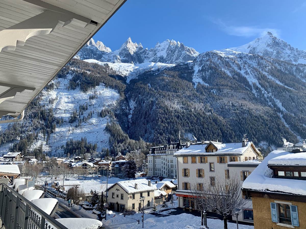Aiguilles in France: a view of the mountains from the balcony of a hotel.