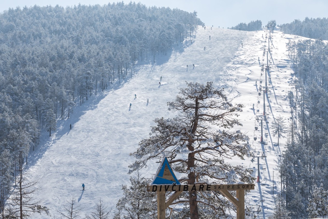 Divčibare in Serbia - a sign on the side of a snowy mountain.