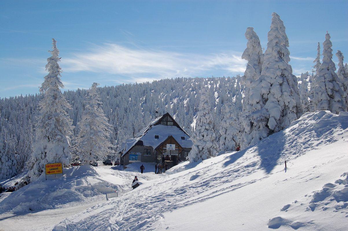 Jugów – Rymarz in Poland - a snow covered ski slope with trees in the background.