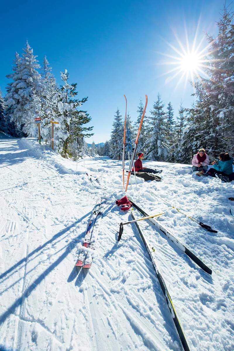 Mézenc – Les Estables in France - a group of people skiing down a snow covered slope.