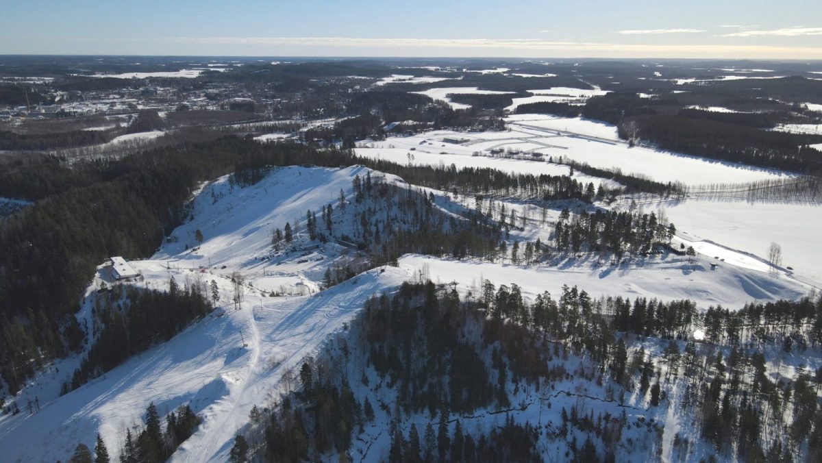 Kalpalinna in Finland - an aerial view of a snow covered mountain.