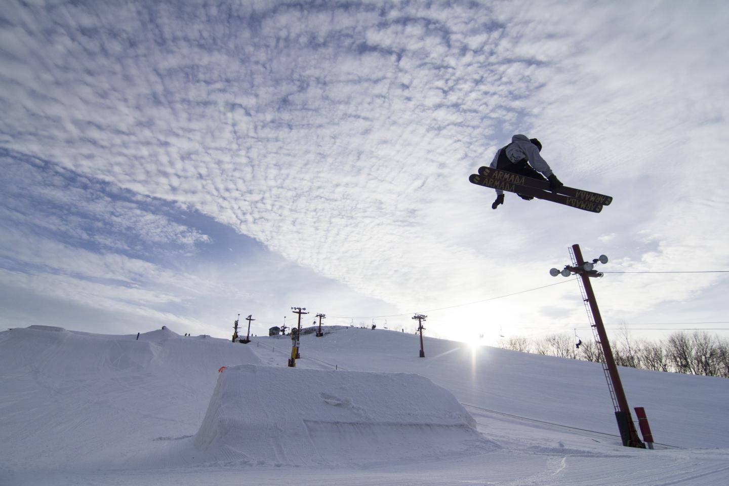 The Rock Snowpark in USA - a snowboarder doing a trick in the air.