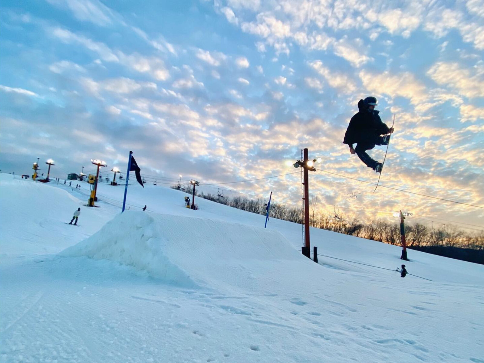 The Rock Snowpark in USA - a snowboarder doing a trick in the air.