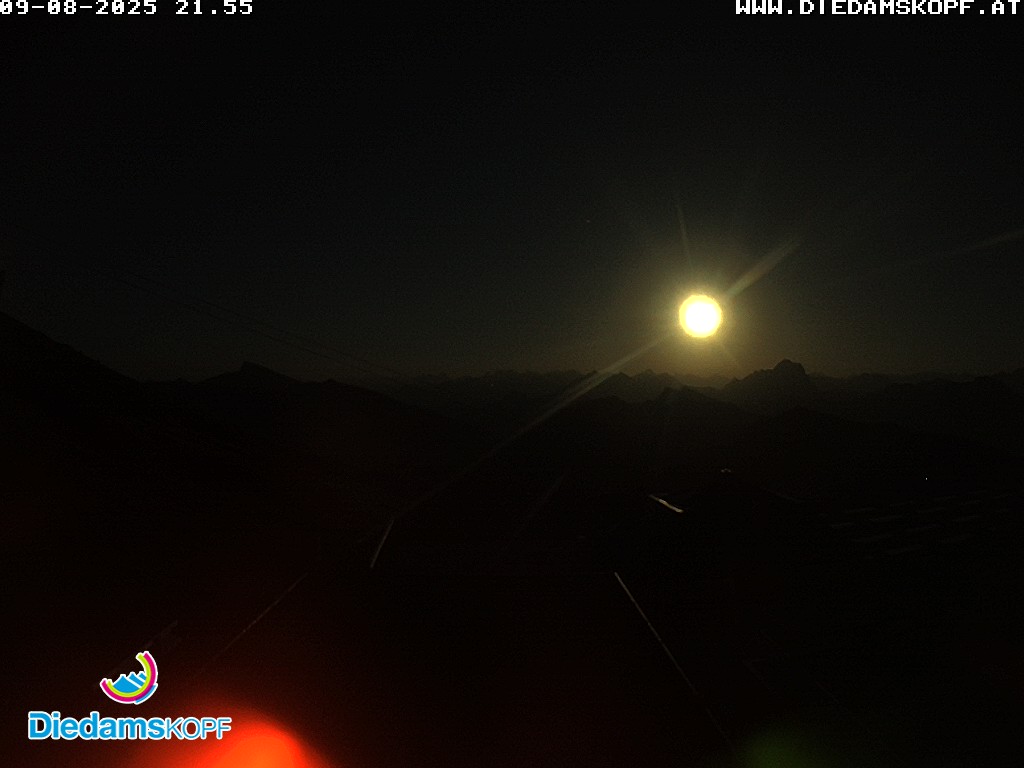 Diedamskopf – Schoppernau in Austria - a dark sky with a red light on it.