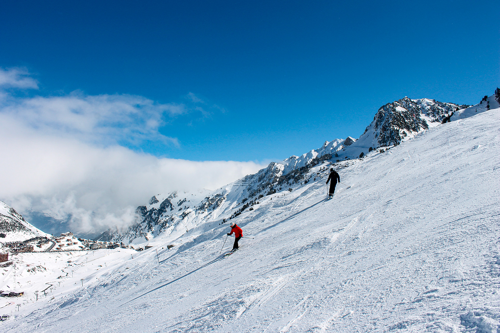 La Mongie | ​Barèges, Grand Tourmalet | ​Pic du Midi in France - a person skiing down a snowy mountain.
