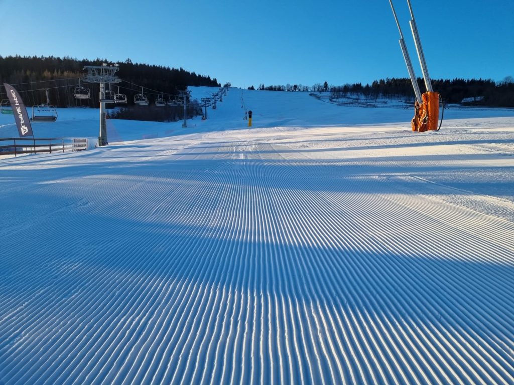 Javorník – Jeřmanice in Czech Republic - a ski slope with a ski lift in the background.