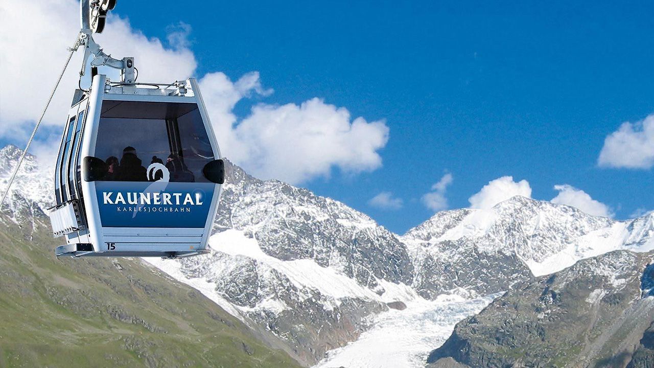 Kaunertaler Glacier in Austria - a cable car going up the side of a mountain.