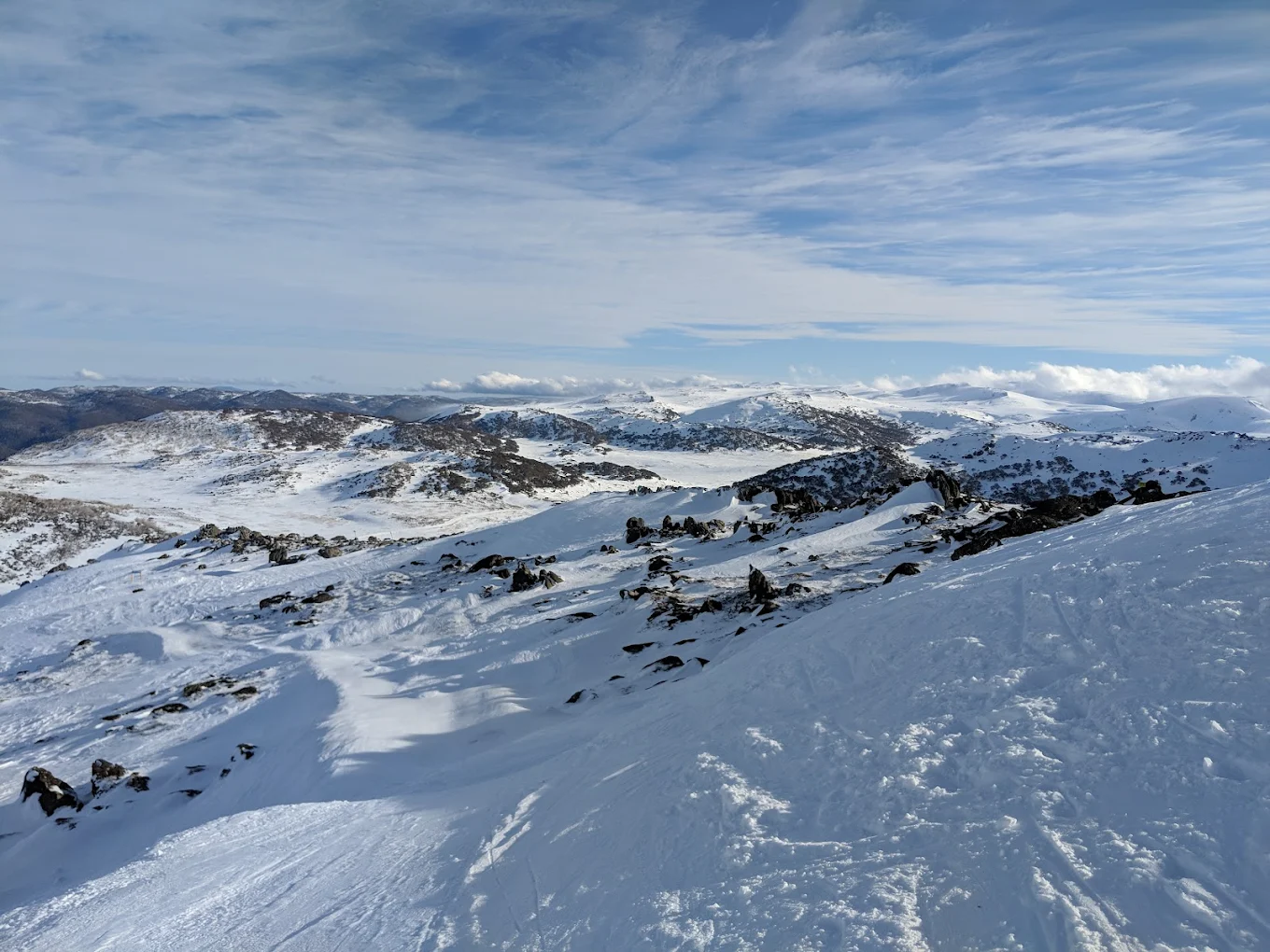 Perisher in Australia - a person on a snowboard on a mountain.