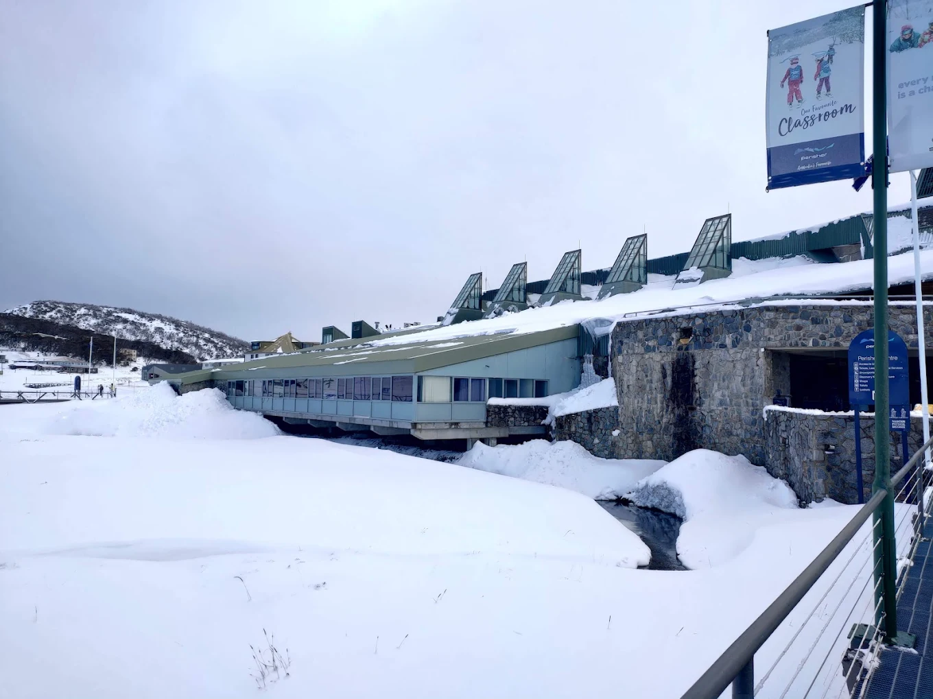 Perisher in Australia: a building with snow on the ground.