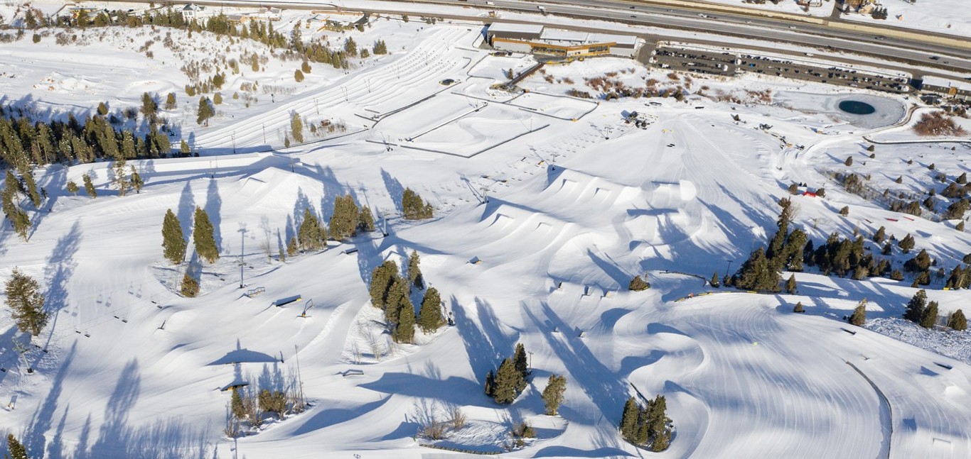 Woodward Park City in USA - an aerial view of a snow covered ski area.