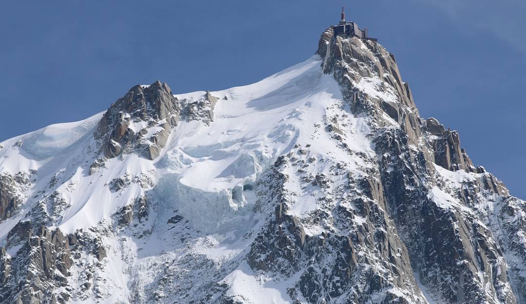 L'Aiguille du Midi in France - a mountain with snow on it's face.