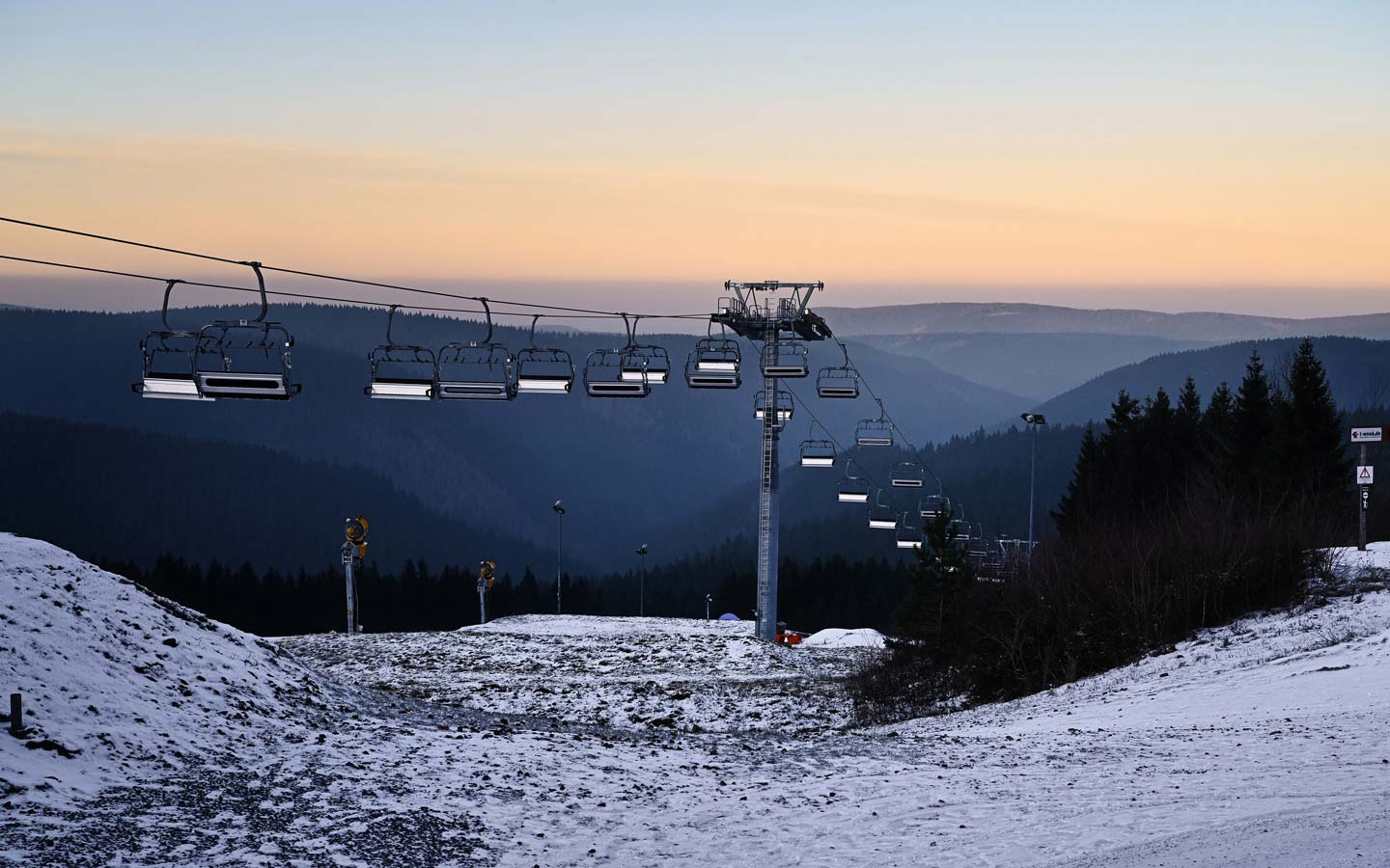 Fallbachhang – Oberhof in Germany - a ski lift going up a snowy hill.