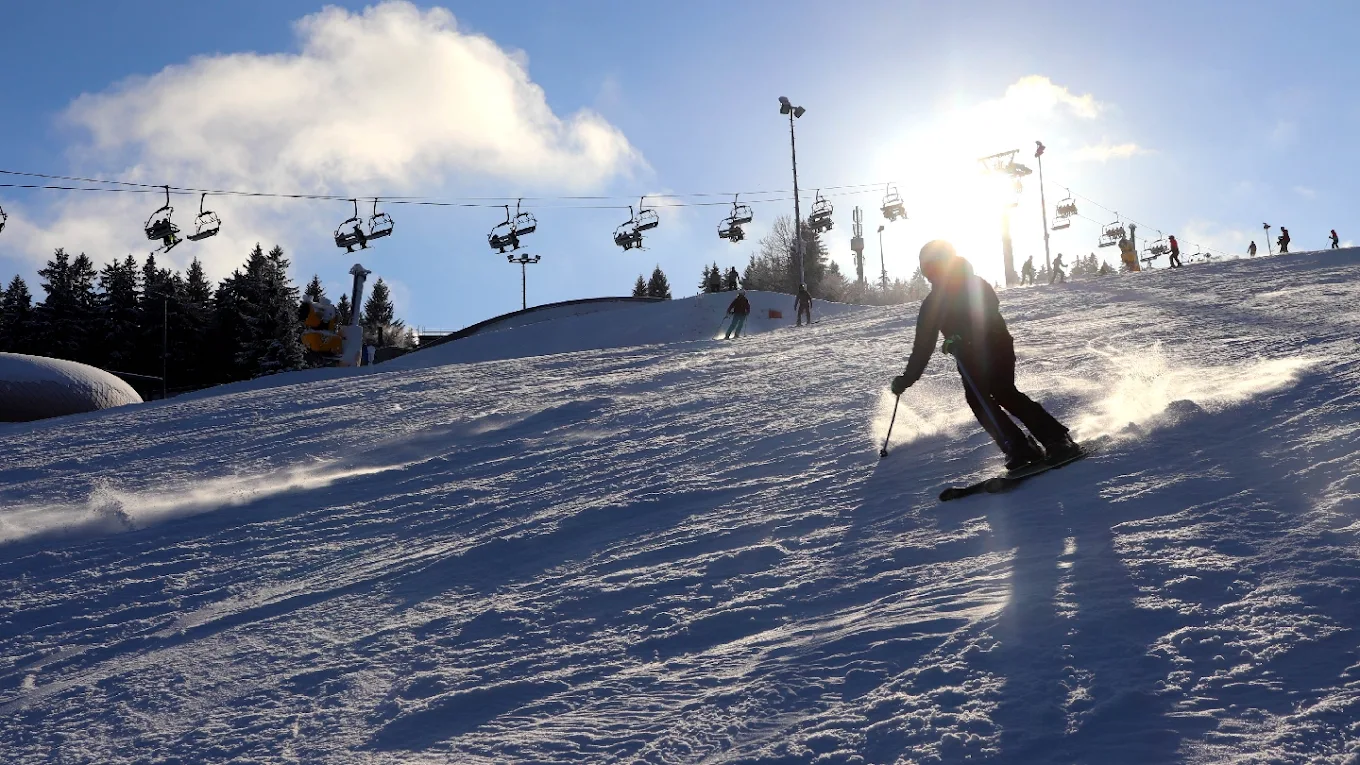 Fallbachhang – Oberhof in Germany - a person skiing down a snow covered slope.