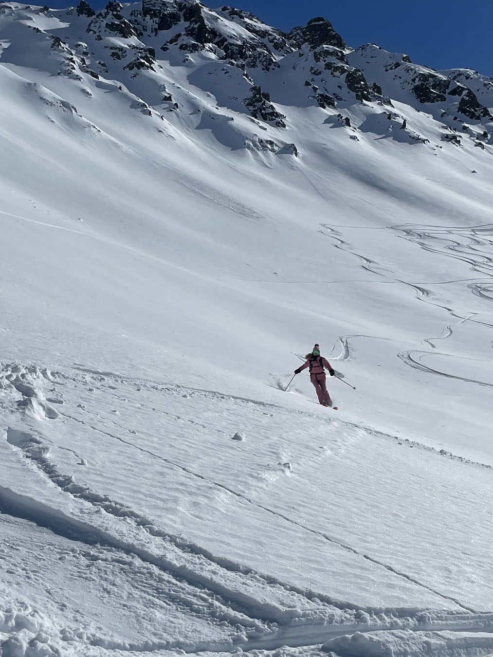 Madrisa in Switzerland - a person skiing down a snow covered mountain.