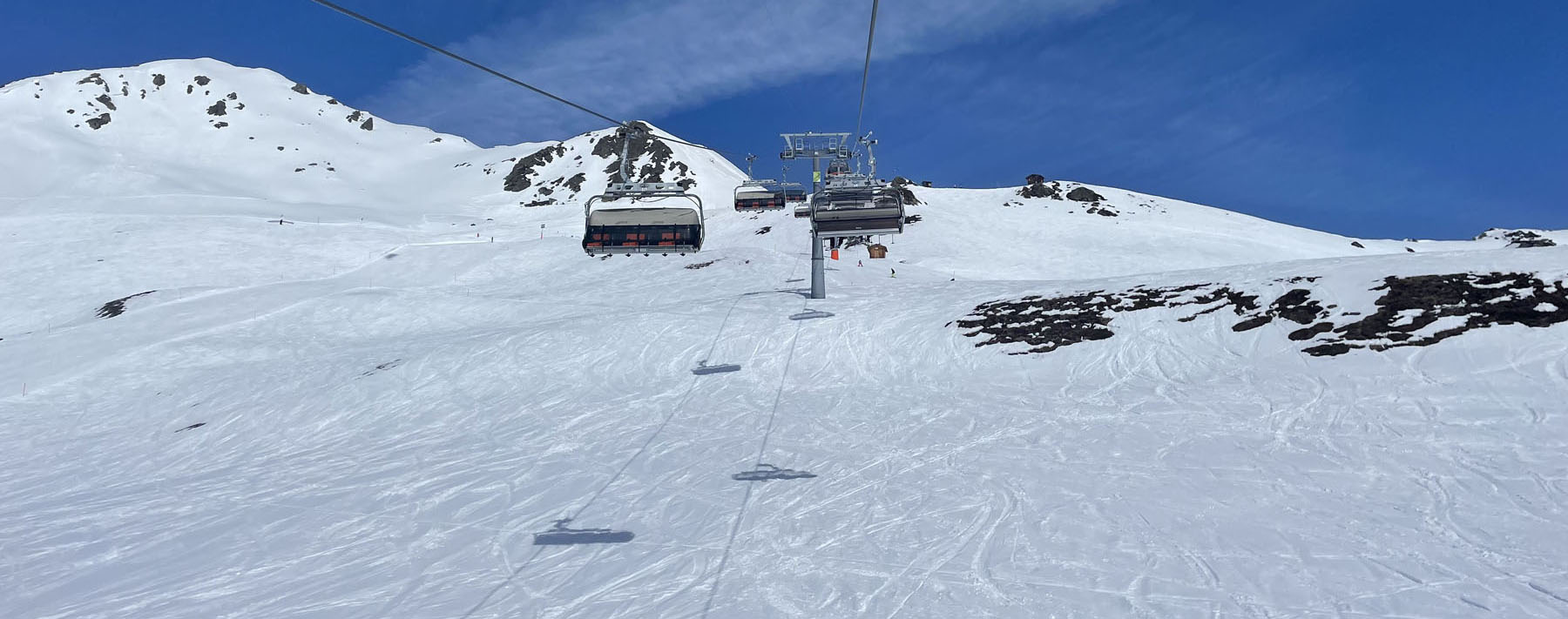 Madrisa in Switzerland - a ski lift going up a snowy mountain.
