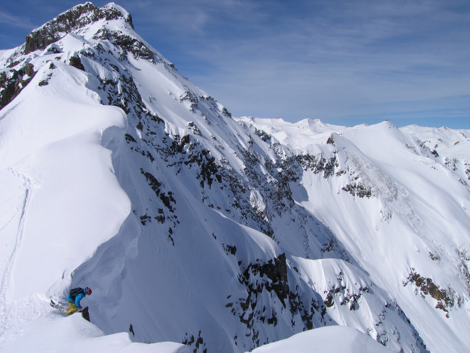 Silverton Mountain in USA - a person on a snowboard on a snowy mountain.