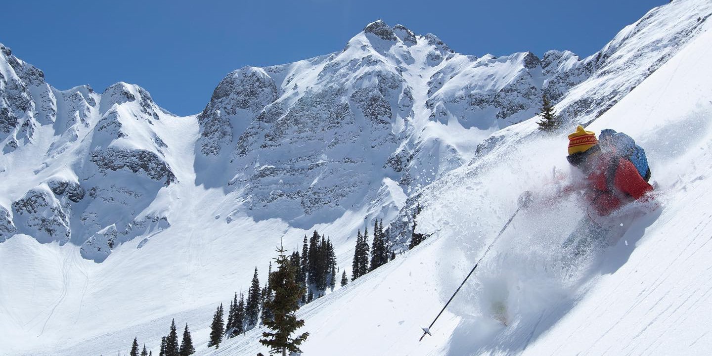 Silverton Mountain in USA - a person skiing down the side of a mountain.