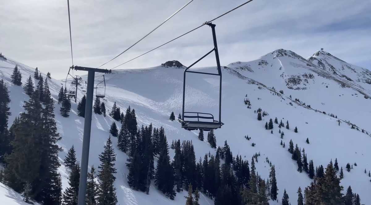 Silverton Mountain in USA - a ski lift going up a snowy mountain.