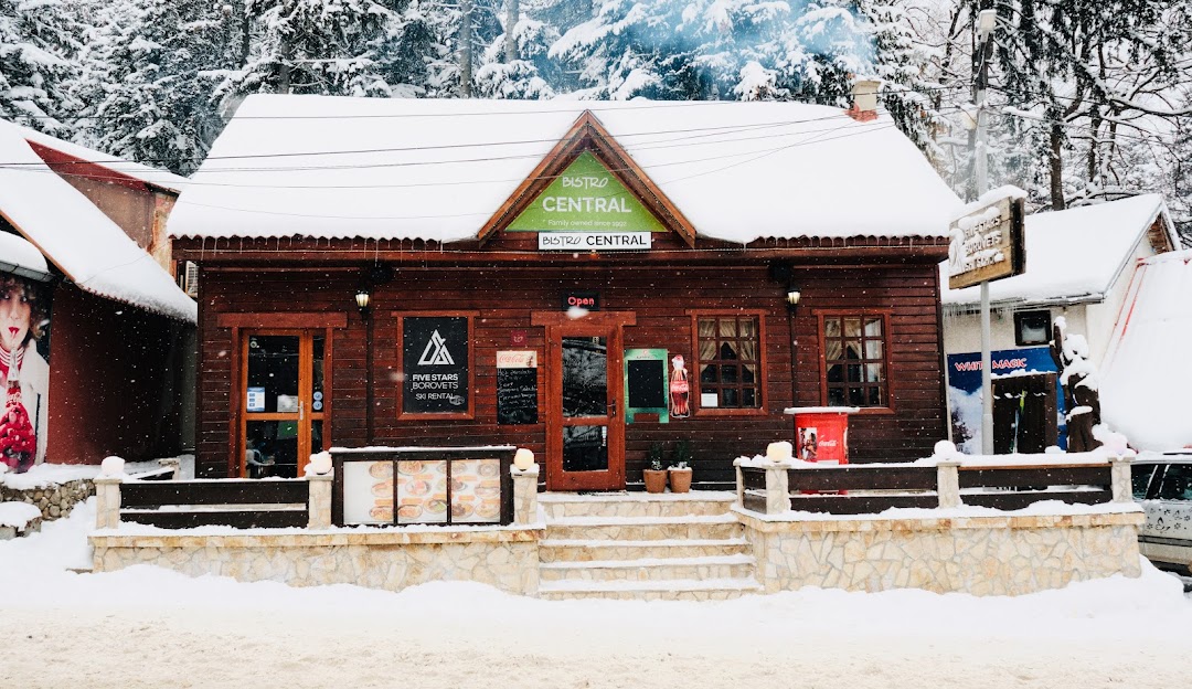 Borovets in Bulgaria: a small building with snow on the ground.