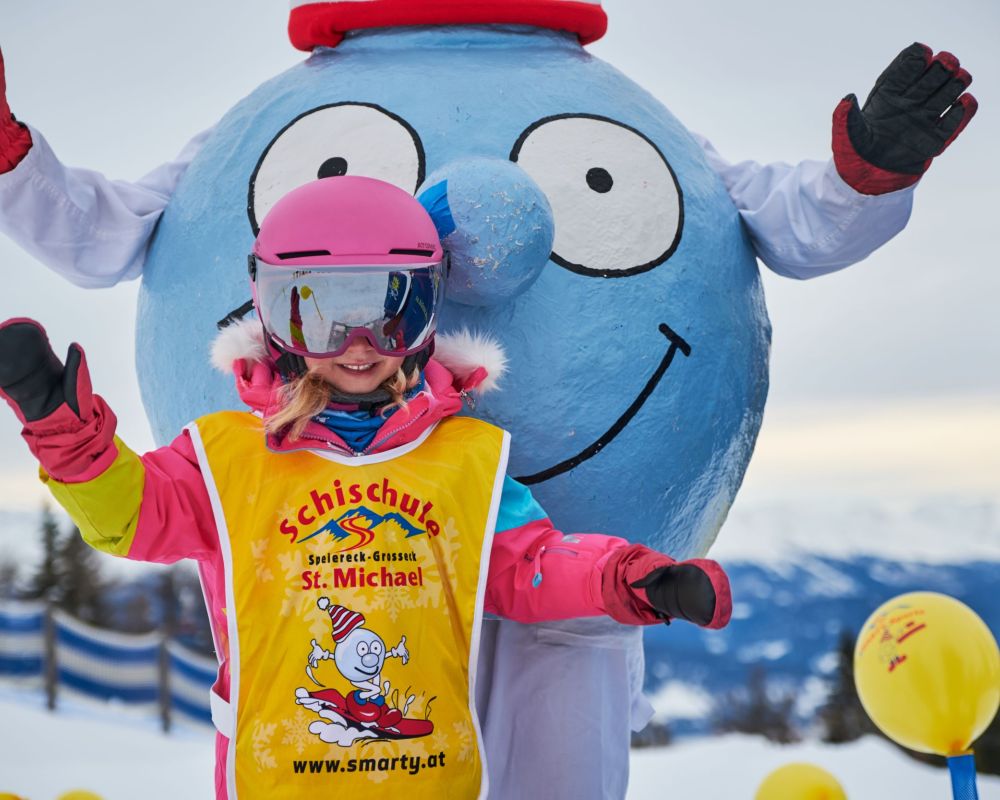 Grosseck | ​Speiereck – Mauterndorf | ​St Michael in Austria - a young girl in ski gear stands in the snow.