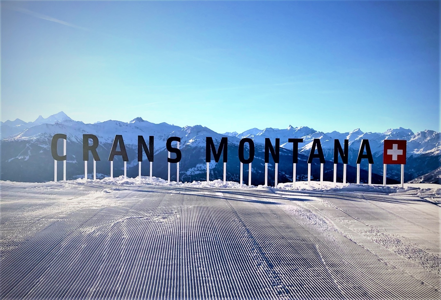 Crans Montana in Switzerland - a picture of a ski slope with the words paris montanaal.