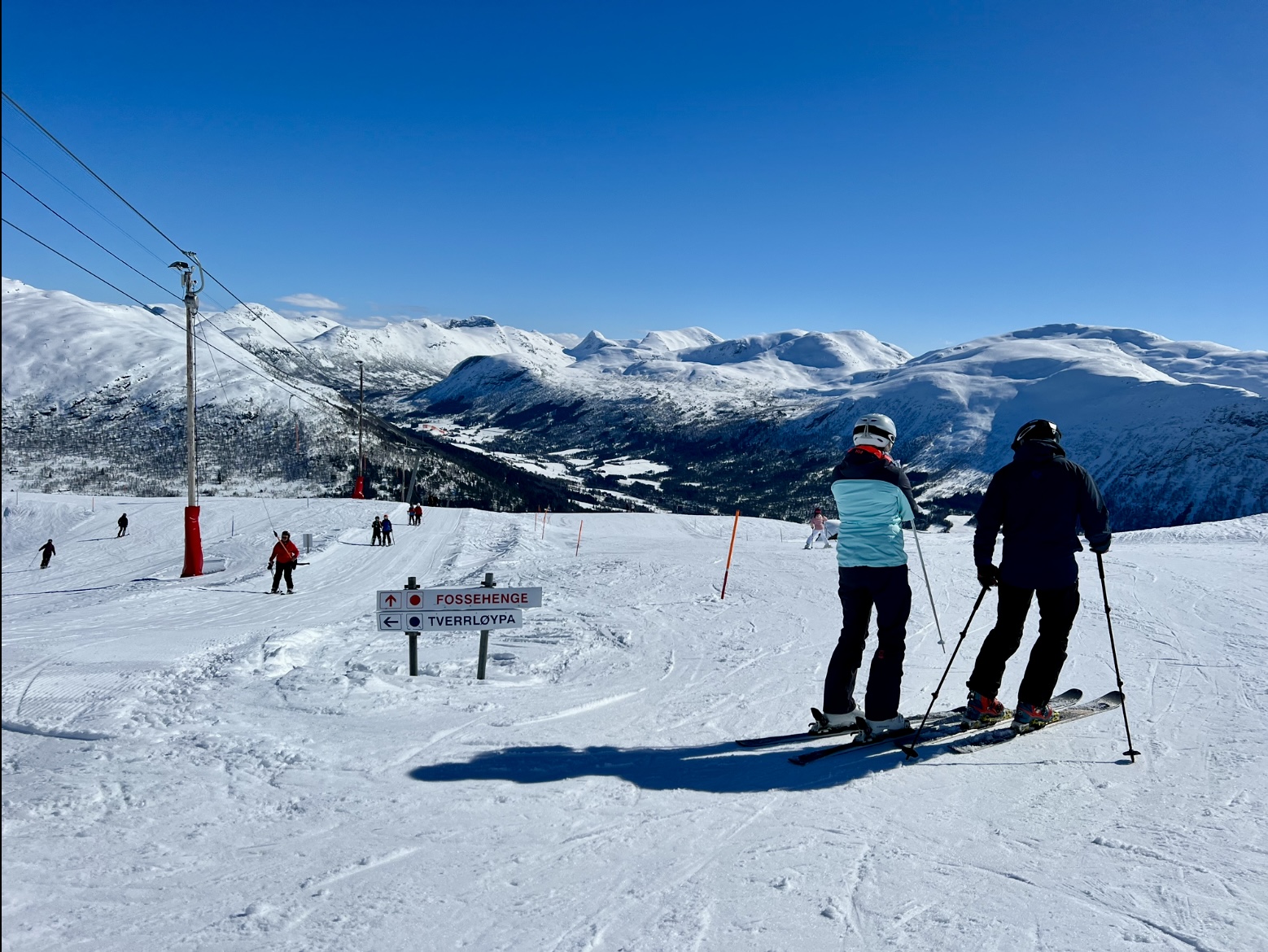 Hornindal in Norway - a group of people skiing down a snowy slope.