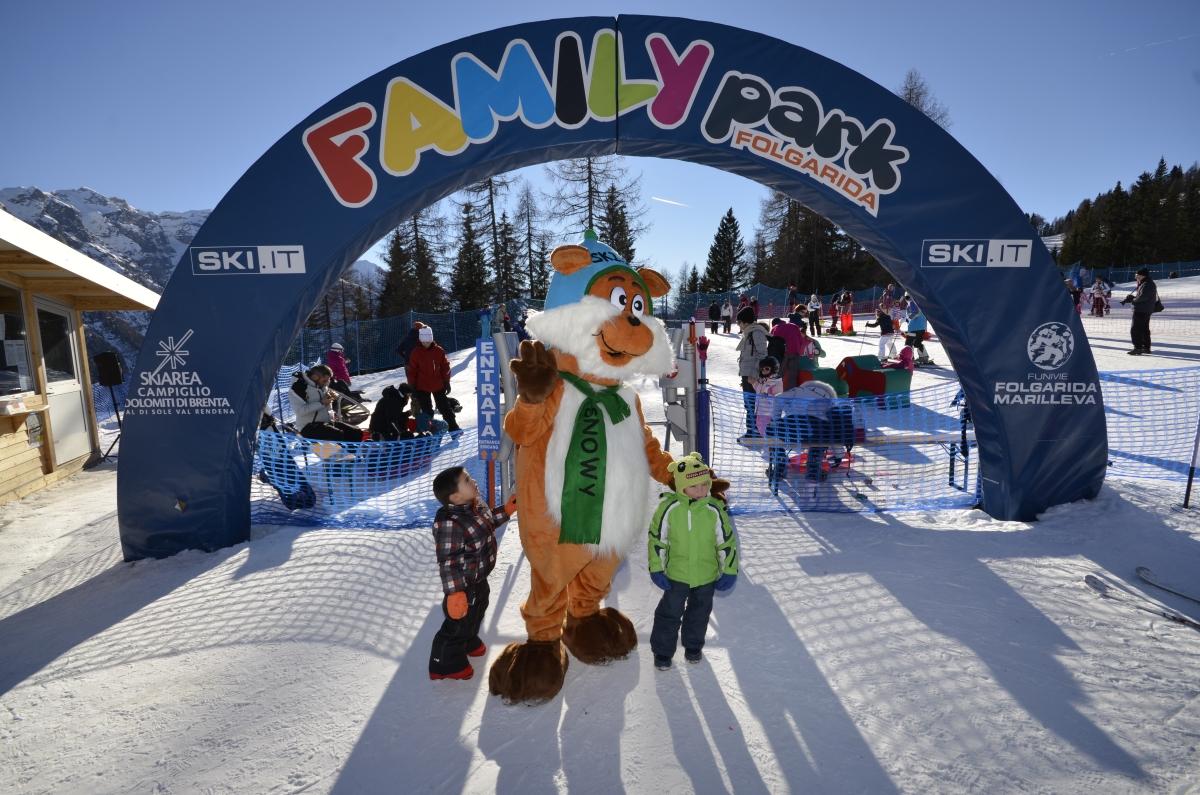 Funivie Folgarida Marilleva in Italy - a person dressed as a fox walks through the finish line.