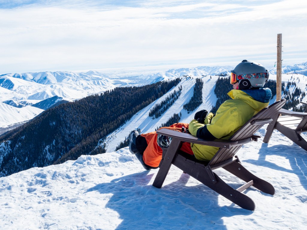 Bald Mountain – Sun Valley in USA - a person sitting in a chair on top of a mountain.