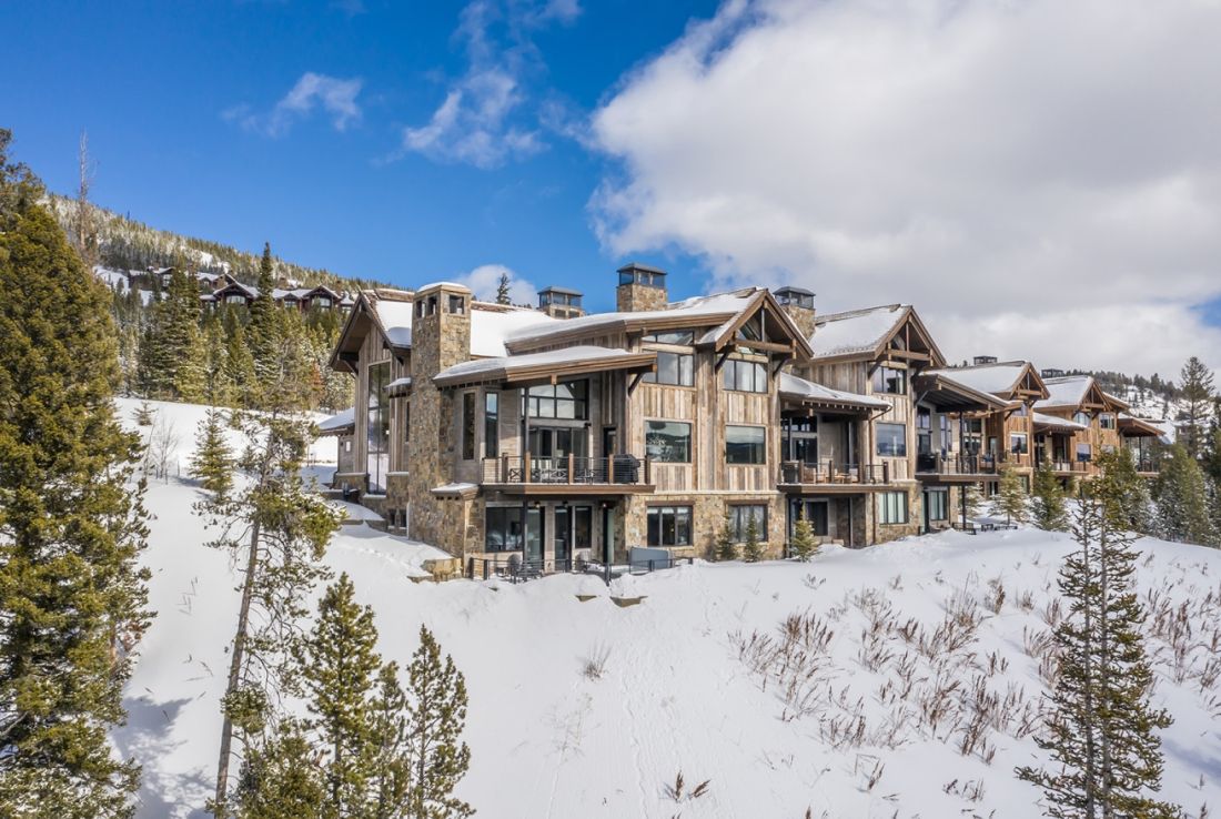 Yellowstone Club in USA - a home in the mountains with snow on the ground.
