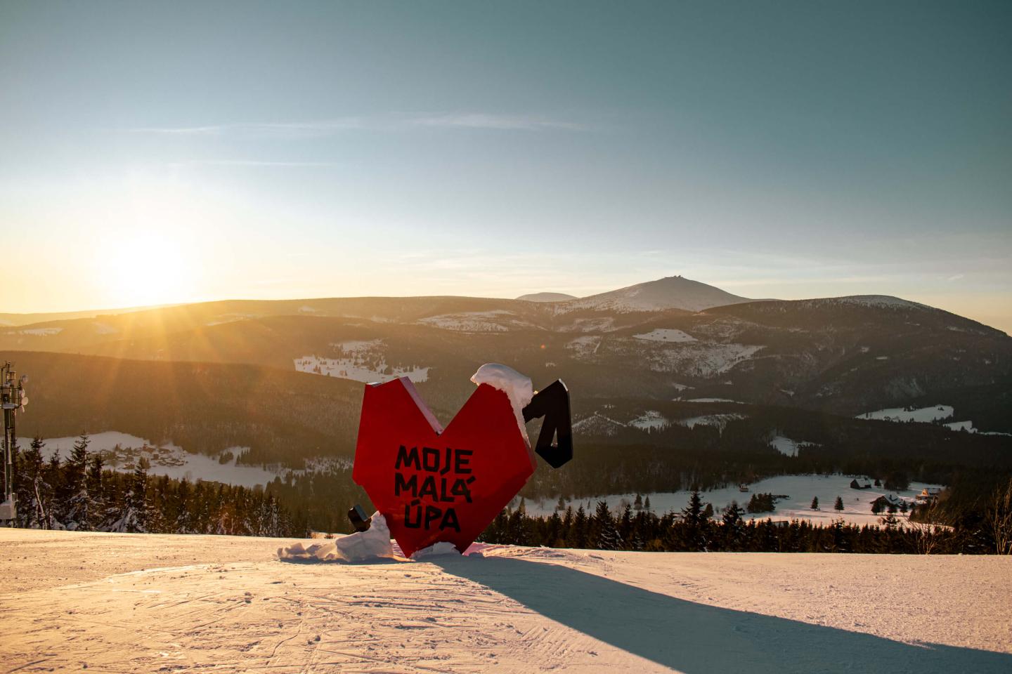 Malá Úpa in Czech Republic - the sun is setting behind the mountains.