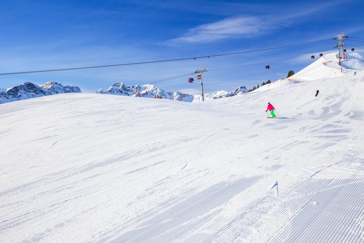 Hörnerbahn GmbH & Co. KG in Germany - a person skiing down a snowy hill.