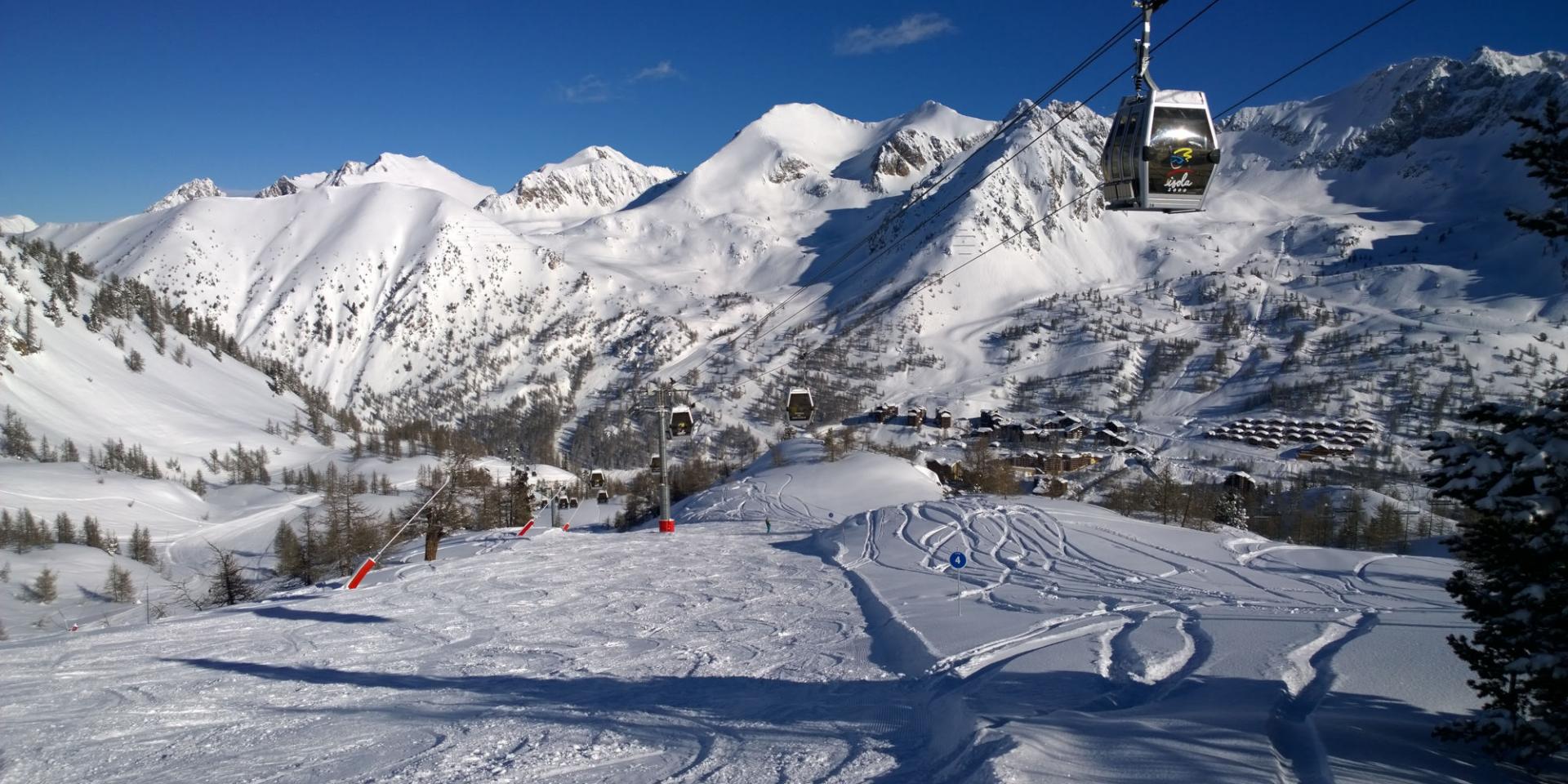 Isola 2000 in France - a ski lift going up a snowy mountain.