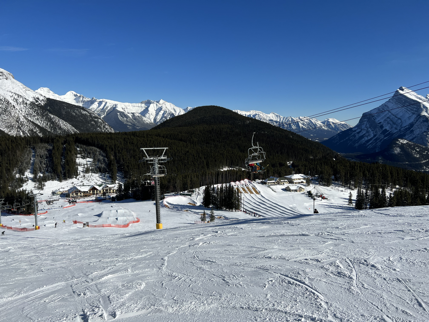 Mt Norquay – Banff in Canada - a ski slope with a ski lift going up the mountain.