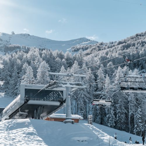 Stunning winter scene at Les Orres ski resort in France, showcasing the vast winter sports centre amidst the crisp, snowy alpine scenery.