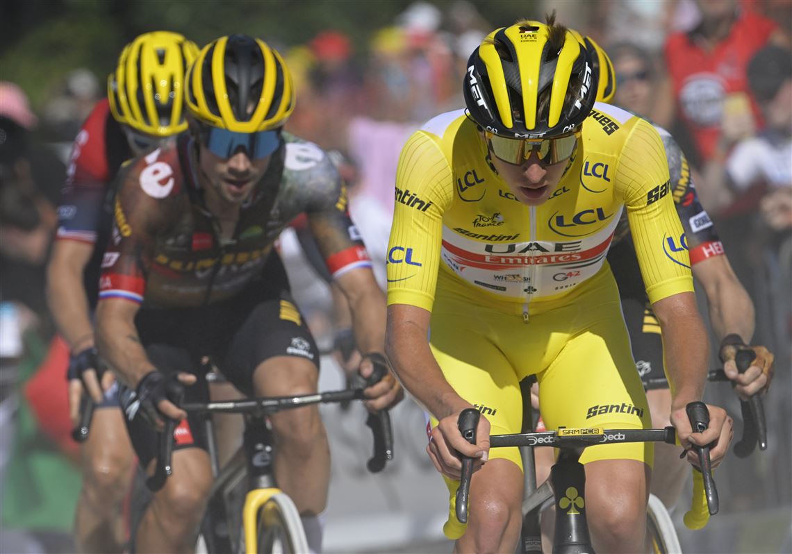 Planche des Belles Filles in France - a group of cyclists riding down a road.