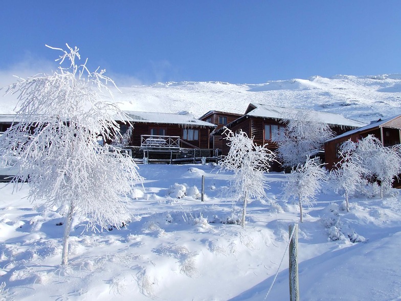 Winter scene at Tiffindell, with a sports centre nestled among snowy landscapes in Barkly East, Eastern Cape, South Africa, showcasing the beauty of the ski resort.