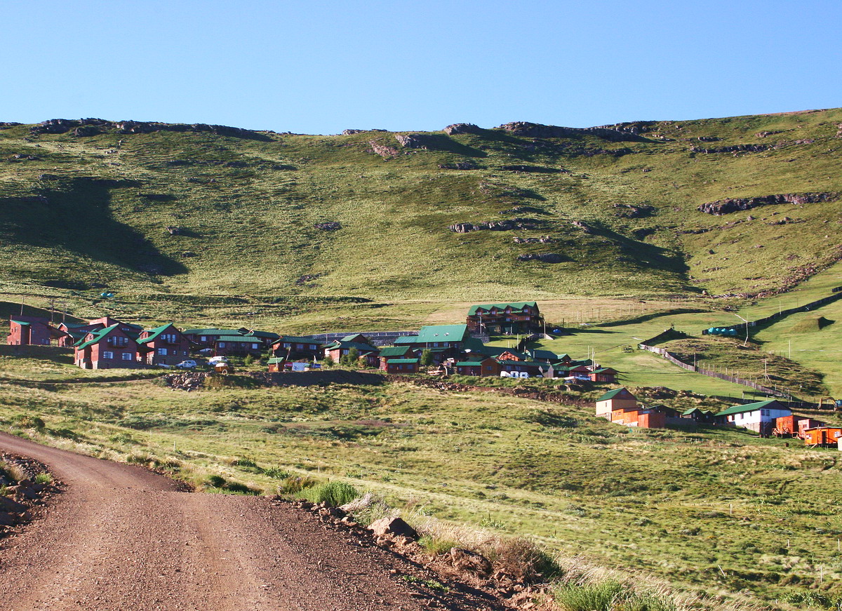 Tiffindell in South Africa - a dirt road in front of a small town.