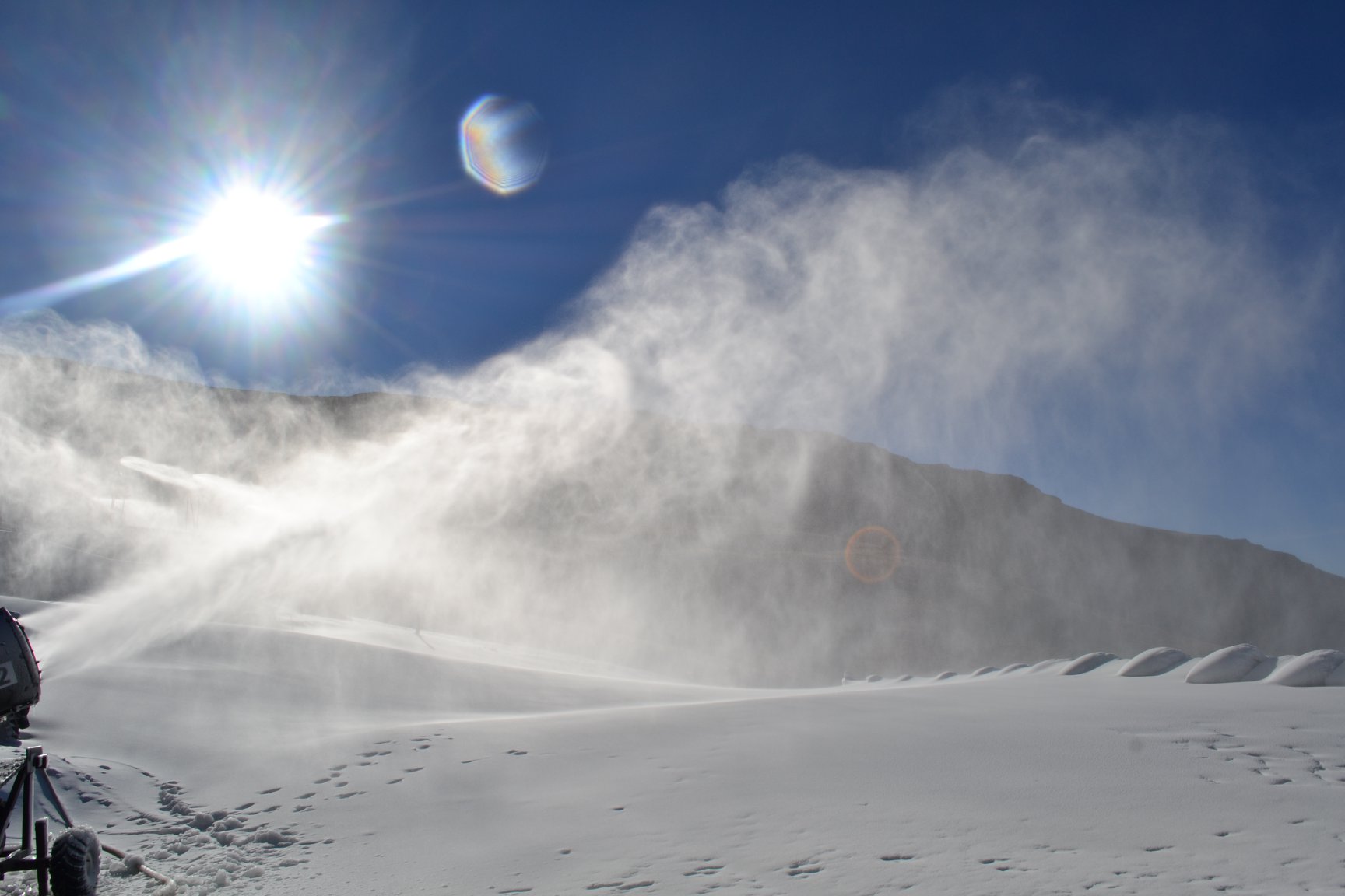A winter sports scene at Tiffindell ski resort in Barkly East, Eastern Cape, South Africa, featuring a skier elegantly navigating the snow-covered slopes amidst captivating winter scenery.