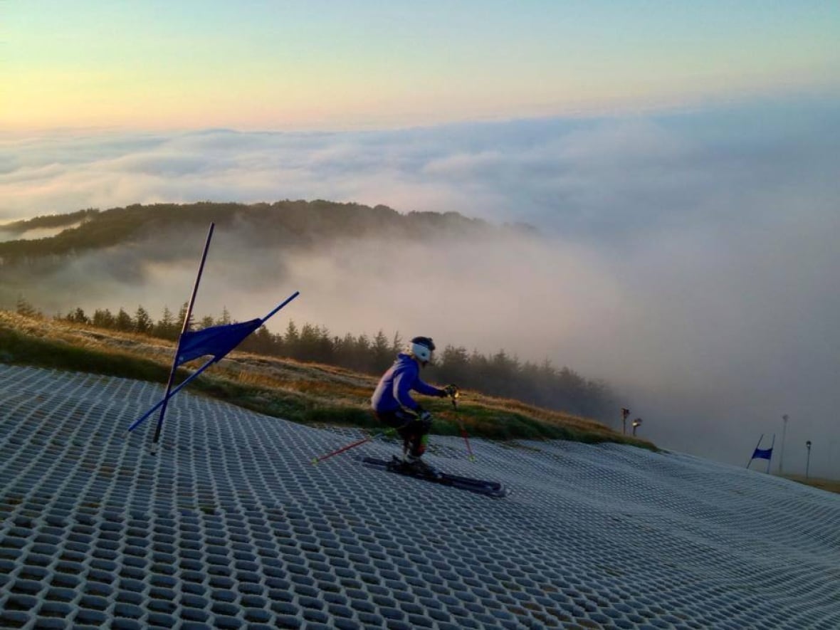 Midlothian Ski Centre in United Kingdom - a person skiing down a hill in the fog.