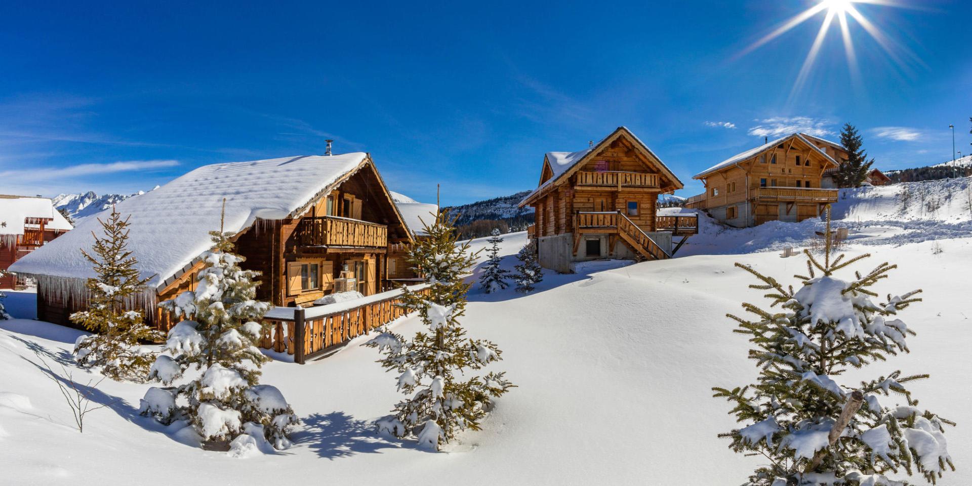 Dévoluy – Superdévoluy | ​La Joue du Loup in France - a house in the snow on a sunny day.