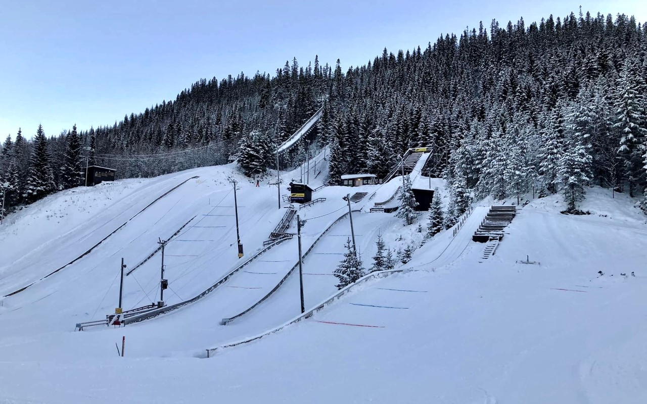 Torsbustaden in Norway - a ski slope with trees in the background.
