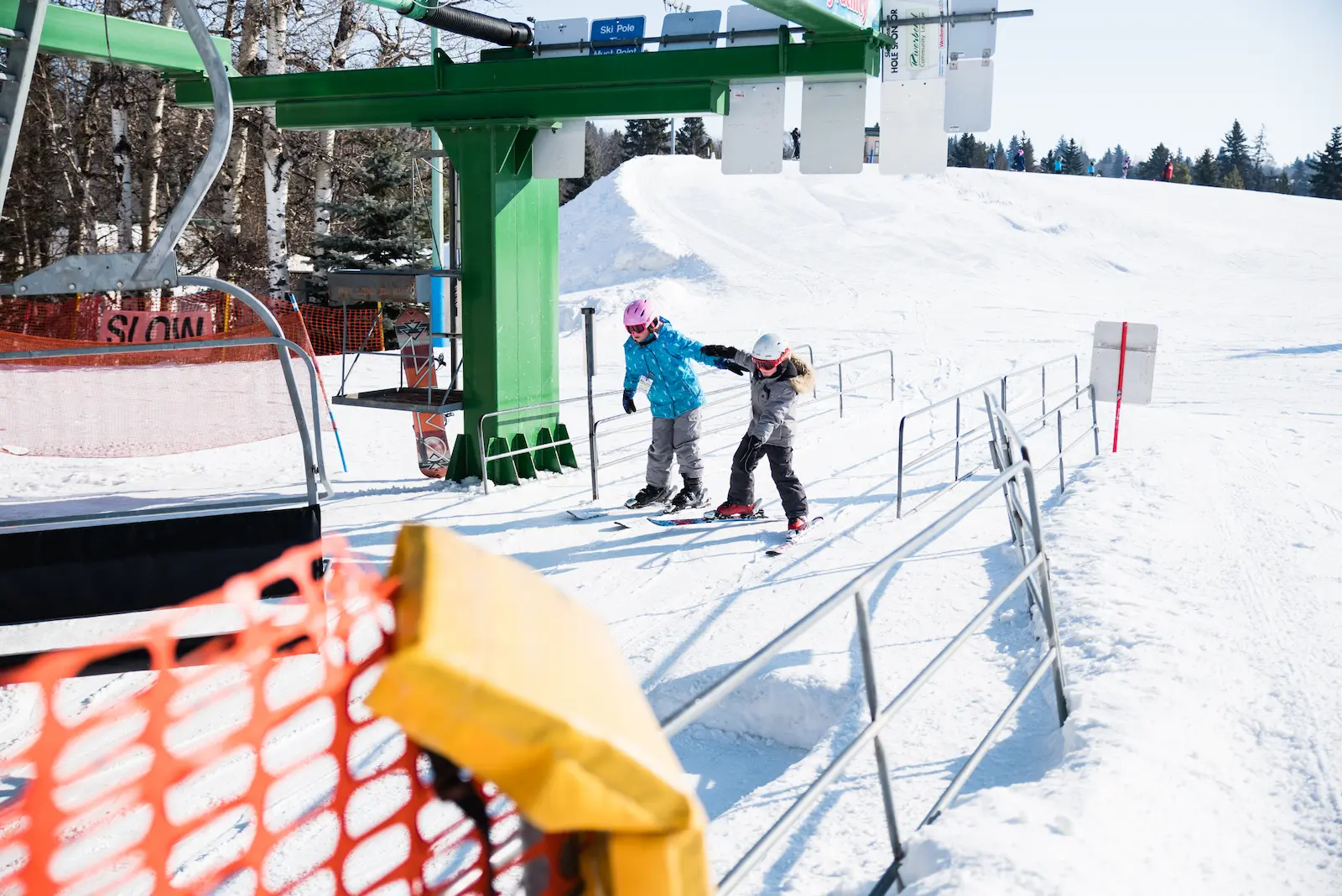 Valley Ski Hill – Alliance in Canada - a person riding a snowboard down a snowy slope.