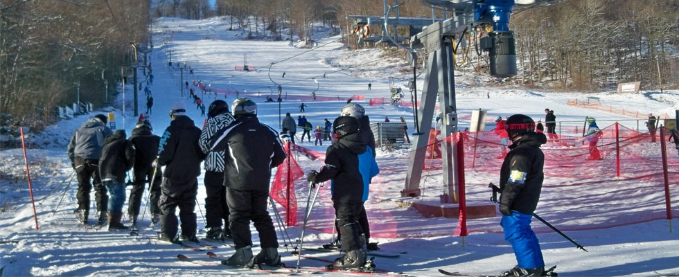 Vångabacken in Sweden - a group of people standing on a ski slope.