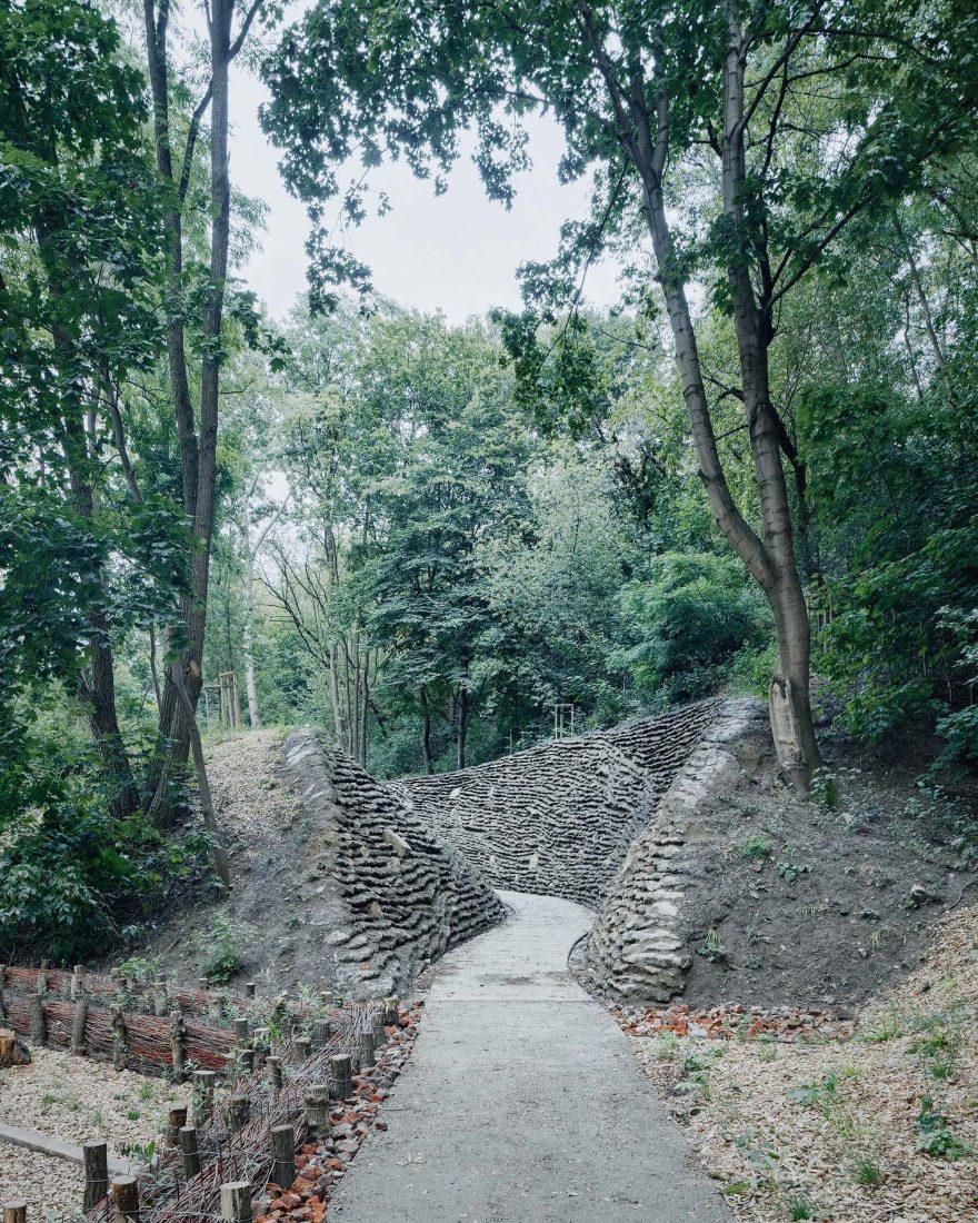 Park Szczęśliwice – Warsaw in Poland - a stone path in the middle of a forest.