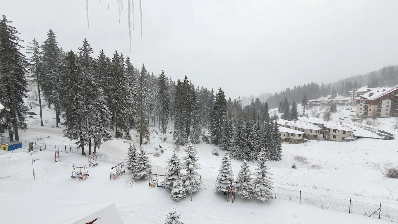 Pamporovo in Bulgaria - a snowy view from the top of a mountain.