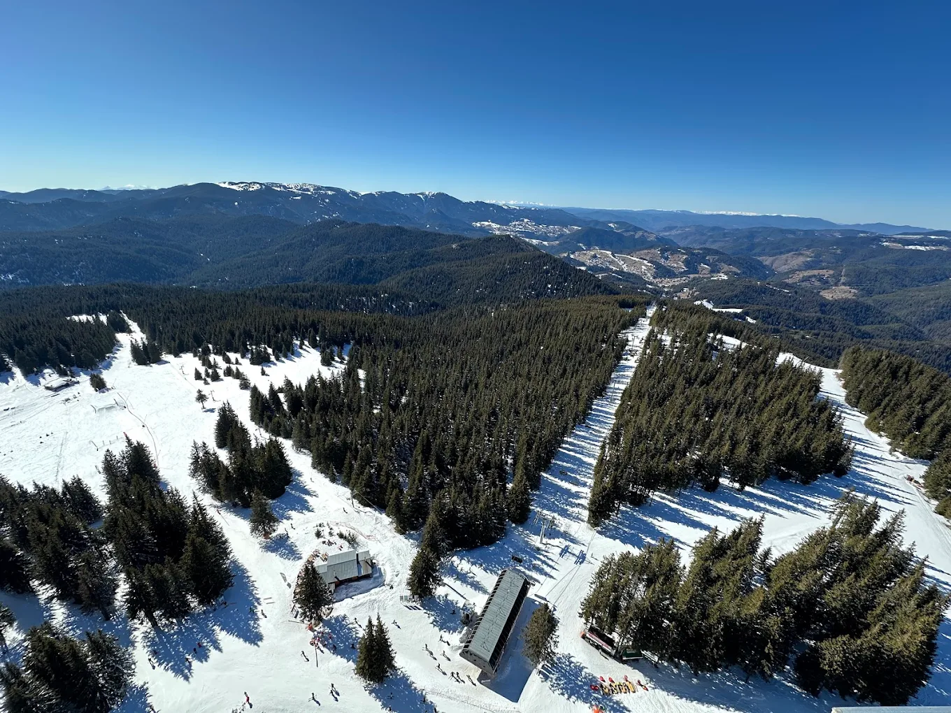 Pamporovo in Bulgaria - a view from the top of a snowy mountain.
