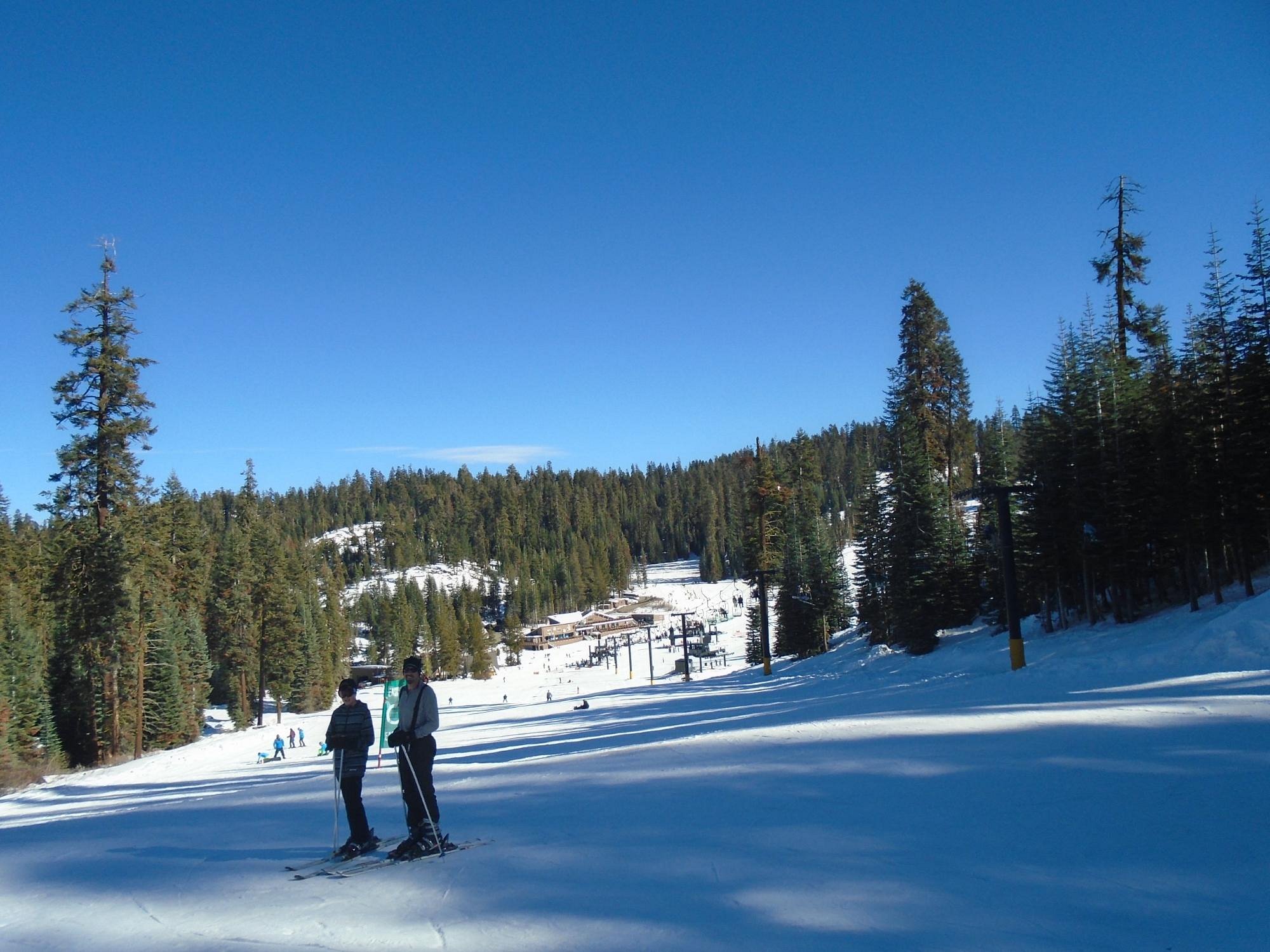 Skiing scene at Badger Mountain, Washington State, USA. Winter scenery with a skier descending the slope, a ski lift in the background, all part of a ski resort.