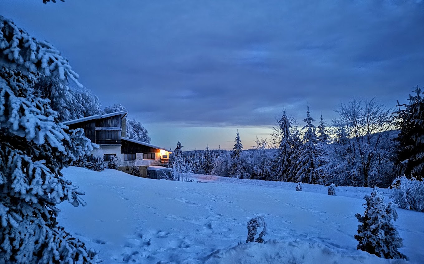 Uzana in Bulgaria - a house in the middle of a snow covered forest.